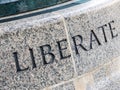 The Word LIBERATE in Stone Royalty Free Stock Photo