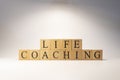 The word life coaching was created from wooden cubes. education and work. Royalty Free Stock Photo