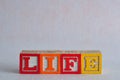 The word life spelled with colorful blocks isolated Royalty Free Stock Photo