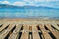 Word lined with small pebbles on wooden sunbed with beautiful la Royalty Free Stock Photo