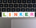 Word Linker on keyboard background Royalty Free Stock Photo