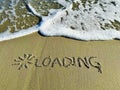 Word loading in the sand Royalty Free Stock Photo