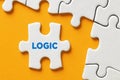 The word logic on a puzzle piece. Logical thinking, problem solving, cognition or attitude