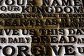 Word of the Lord`s Prayer on the old black weathered wooden pla