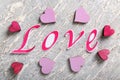 Word LOVE with color hearts on light background Royalty Free Stock Photo