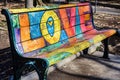 Word LOVE in a graffiti style. Bright letters on the street bench Royalty Free Stock Photo