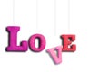 The word Love hanging on a rope on a white background