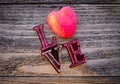 Word Love with heart on vintage wooden background, top view Royalty Free Stock Photo