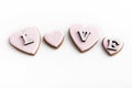 Word LOVE and homemade Valentines Day cookies shape of hearts