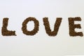 The word LOVE made from cumin in a white background