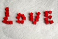 The word LOVE is made of red cubes. Red wood cubes for valentine's day. From the game cubes is laid the word Love. Royalty Free Stock Photo