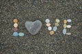 Word love made from stones on sandy beach. Royalty Free Stock Photo