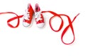 Word Love Made From Tiny Red Sneakers and a Lace Royalty Free Stock Photo
