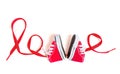 Word LOVE Made from Tiny Shoes and Lace on White Royalty Free Stock Photo