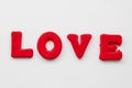 The word Love is made up of red letters on a white background