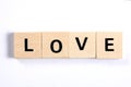 Word love written with wooden blocks isolated on white background Royalty Free Stock Photo