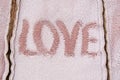 Word love on the seamy surface of fur warm clothes Holidays valentines day celebrations love trendy and glamor concept