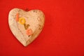 The word love on top of a wooden heart Royalty Free Stock Photo