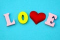 The word love Valentine`s day with colorful wooden letters. Love and heart - a symbol of Valentine`s day. macro. Royalty Free Stock Photo