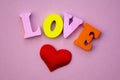 The word love Valentine`s day with colorful wooden letters. Love and heart - a symbol of Valentine`s day. macro. Royalty Free Stock Photo