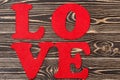 Word Love on wooden background for Valentine's day