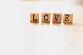 Word love on wooden dice and white background Royalty Free Stock Photo
