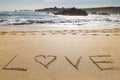 Word love written in the sand of a beautiful beach Royalty Free Stock Photo