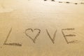 Word love written in the sand of a beautiful beach Royalty Free Stock Photo