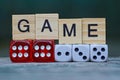 Word made of wooden letters and red and white dice Royalty Free Stock Photo