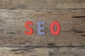 The word SEO is make from wood on wooden background