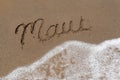 Word Maui Written Into the Sand With Sea Foam
