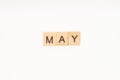 Word MAY made of wooden blocks on white background. Month of year