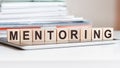 The word mentoring is written on wooden cubes, concept Royalty Free Stock Photo