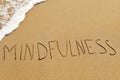 Word mindfulness in the sand