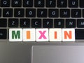 Word Mixin on keyboard background Royalty Free Stock Photo