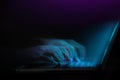 Word of Mouth, Power on the Internet Concept. Motion Blurred image of Hand Using Computer Laptop Keyboard on Desk in Dark Room. Royalty Free Stock Photo