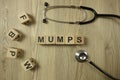 Word mumps from wooden blocks with stethoscope