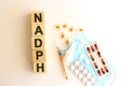 The word NADPH is made of wooden cubes on a white background. Medical concept Royalty Free Stock Photo