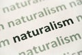 Word naturalism printed on paper macro Royalty Free Stock Photo