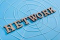 The word network with wooden letters in the form of an abstract spider web Royalty Free Stock Photo