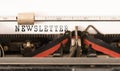 Word NEWSLETTER written on vintage typewriter Royalty Free Stock Photo