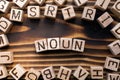 word noun composed of wooden cubes with letters, Royalty Free Stock Photo