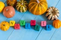 Word November On child's toy cubes and pumpkins on