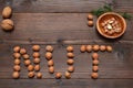 the word nut laid out from hazelnuts on the table Royalty Free Stock Photo