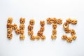 Word NUTS made of walnut on white background Royalty Free Stock Photo