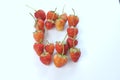 Word ` O ` made from strawberries on white background for design. Card and t-shirt design Royalty Free Stock Photo