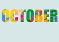 The word OCTOBER, composed of colorful autumn leaves of different plants, isolated on a pastel blue background. Royalty Free Stock Photo