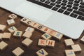 A word OCTOBER made of wooden alphabet letters vocabulary game on the brown table