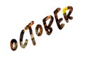 The word October written on a background of colorful autumn leaves Royalty Free Stock Photo