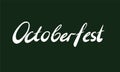 Word Octoberfest on dark green bacjground. Hand-written lettering. Octoberfest holiday concept Royalty Free Stock Photo